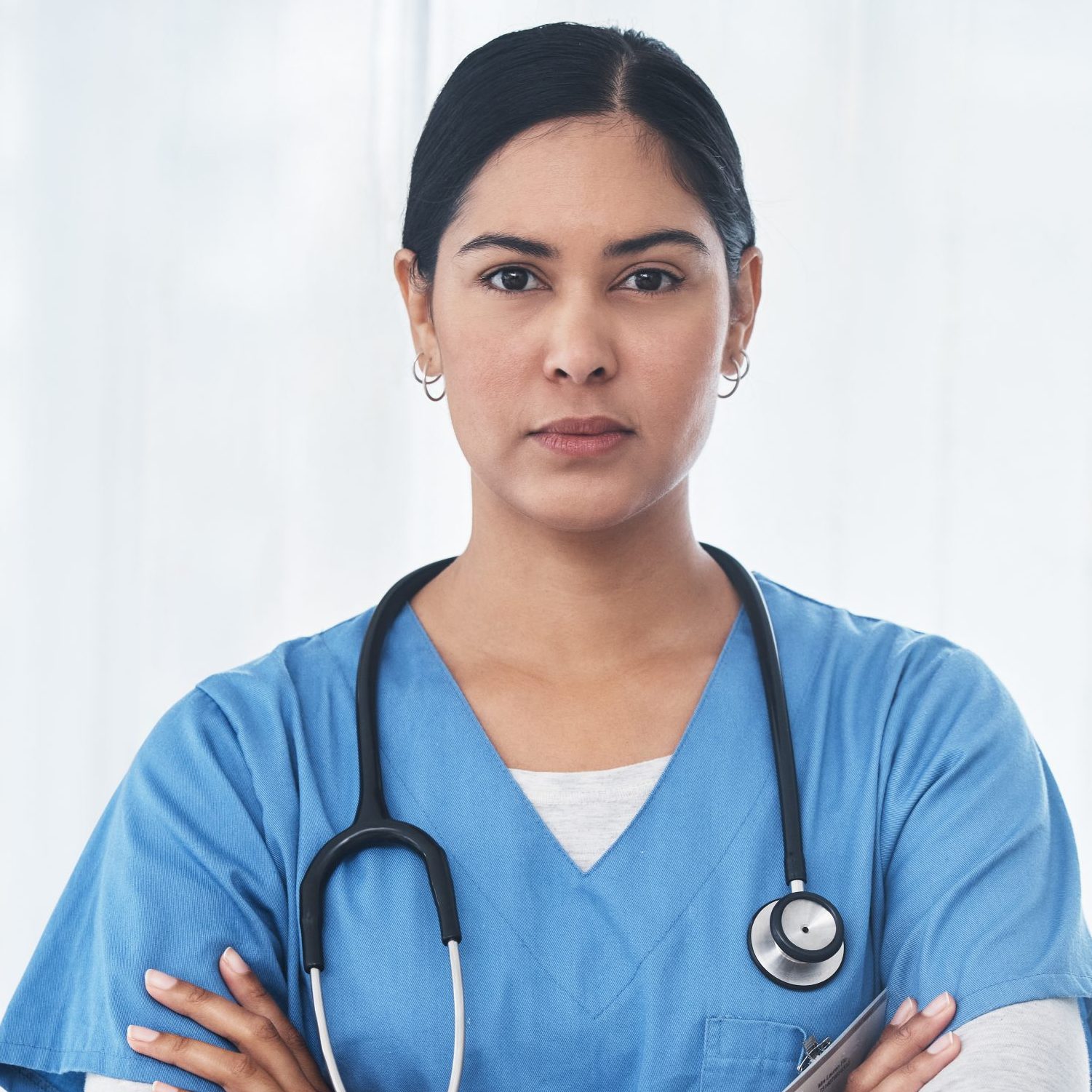 Shot of a medical practitioner standing with her arms crossed.